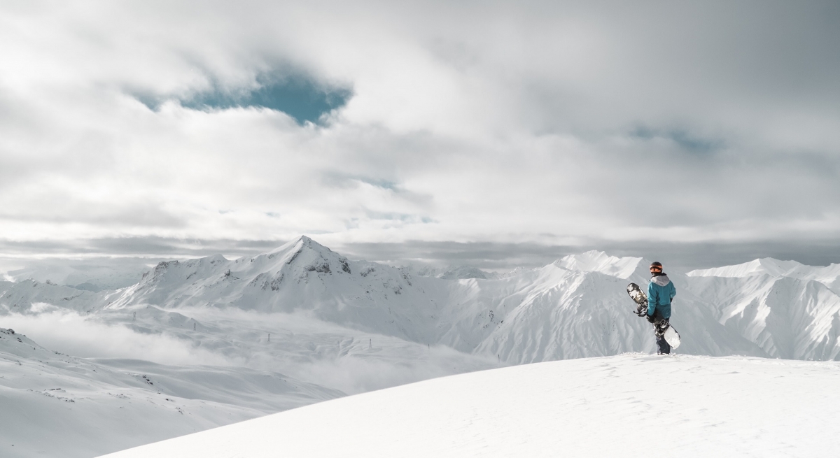 Snowboarder at the top of a hill