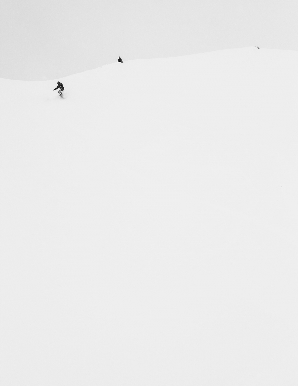 Snowboarder at the top of a hill