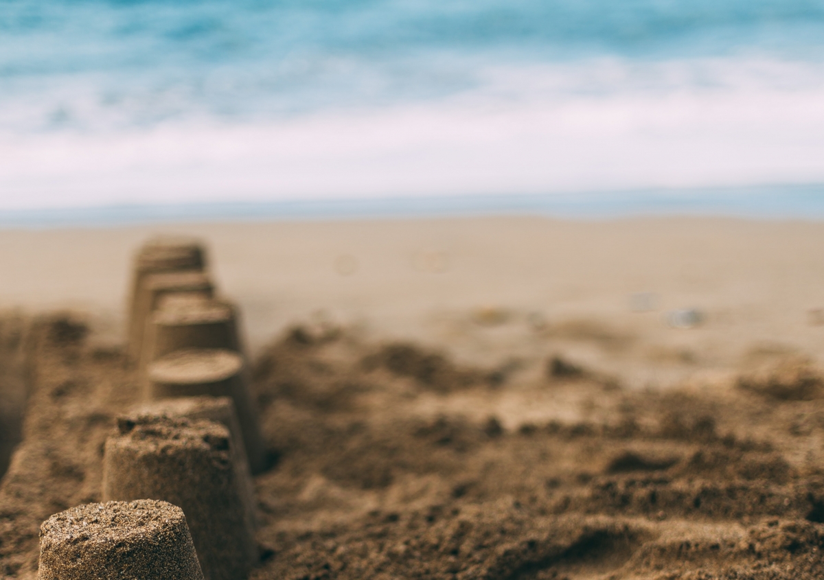 Sand castles on a beach.
