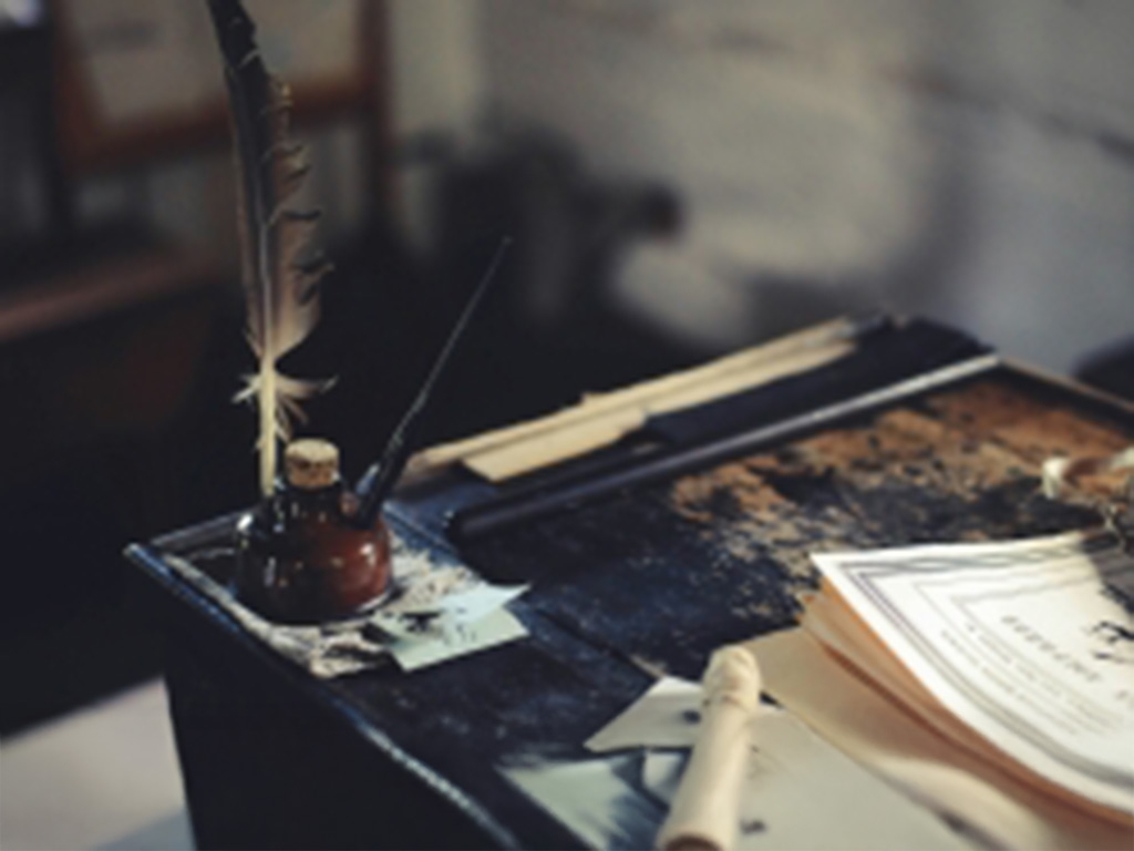 quill on a workbench