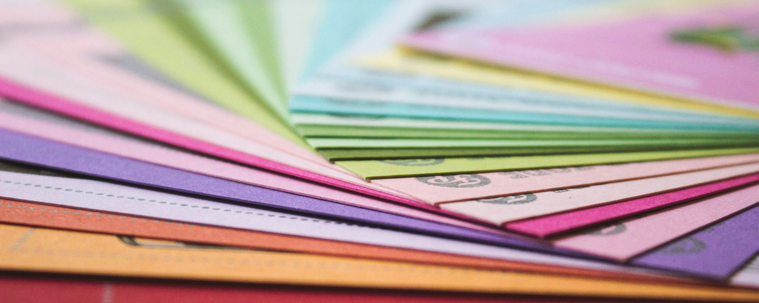 Coloured card piled on top of one another.