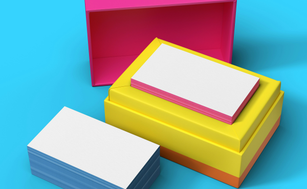 Open pink and yellow boxes revealing note cards against a blue background.