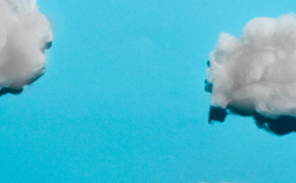 White clouds against a blue background.
