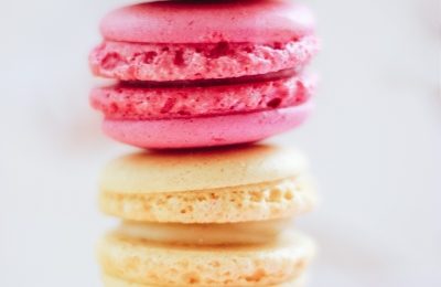 Stack of pink and yellow macarons