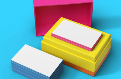 Open pink and yellow boxes revealing note cards against a blue background.