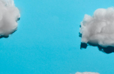 White clouds against a blue background.